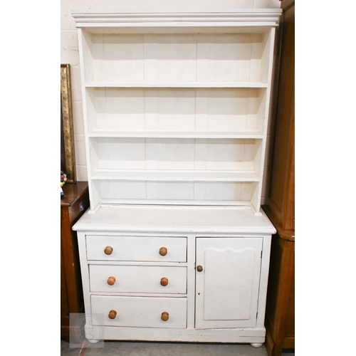 147 - A vintage painted pine dresser with open plate rack on a base with three drawers and single cupboard... 