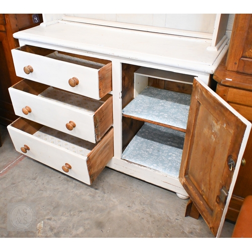 147 - A vintage painted pine dresser with open plate rack on a base with three drawers and single cupboard... 