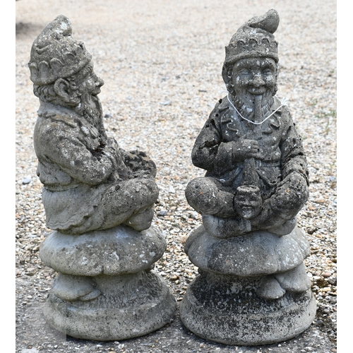 19 - Two weathered reconstituted stone garden gnomes, smoking pipes (2)