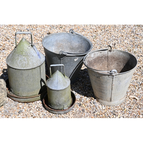 36 - A pair of galvanised buckets to/with two graduated poultry feeders and a cylindrical scuttle (4)
