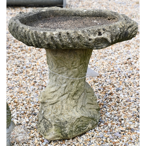 37 - Small garden states - two small weathered reconstituted stone dogs to/with a low bird bath and a sea... 