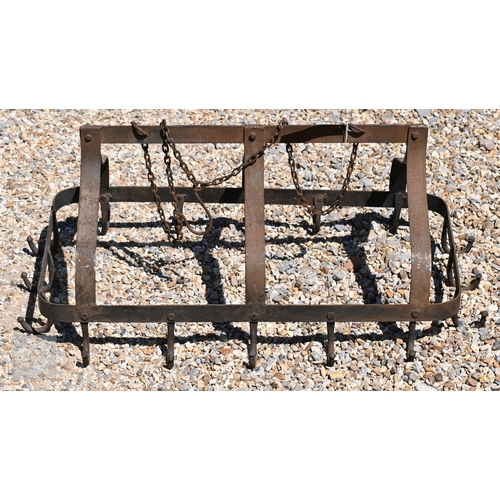 43 - A French wrought iron game hanger with triple Arabic form arch top, with suspension chain, 69 cm x 3... 