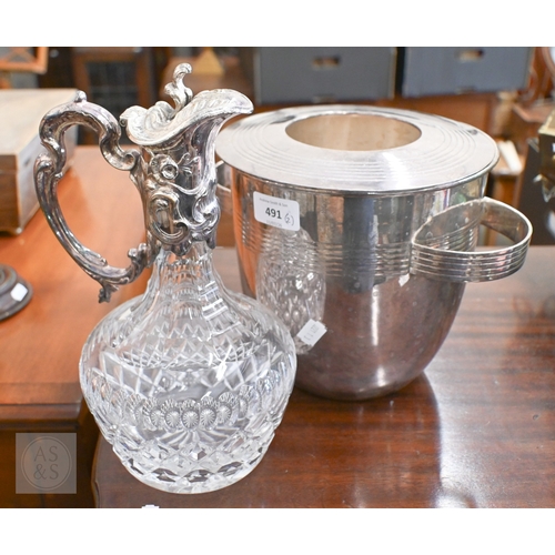 491 - A cut glass claret jug with EP collar, cover and handle, to/w an Art Deco style champagne ice-bucket... 