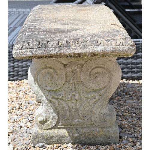 7 - A weathered cast stone three piece garden bench, 116 cm x 40 cm x 42 cm h