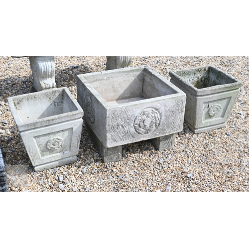 8 - A square cast stone planter with Hampshire rose panels, on blocks, 51 cm x 51 cm x 40 cm  to/w a pai... 