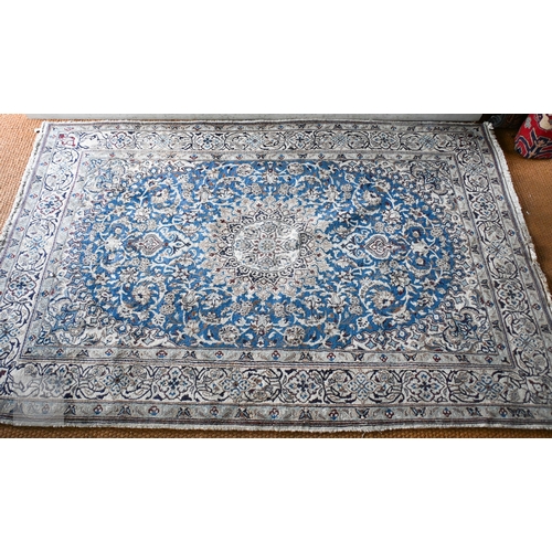 273 - A Persian Nian Shah Abbas design carpet with central medallion and arabesques on blue ground, floral... 