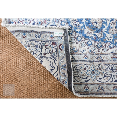 273 - A Persian Nian Shah Abbas design carpet with central medallion and arabesques on blue ground, floral... 