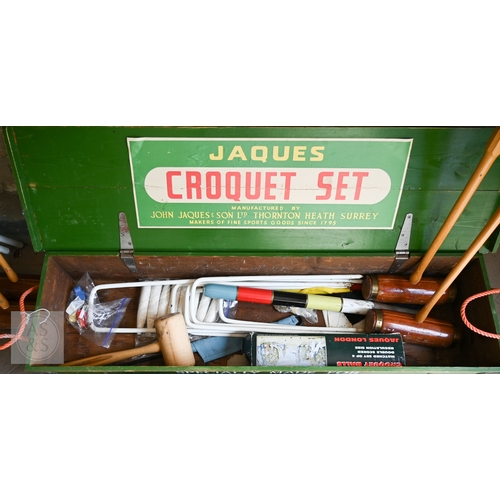 11 - Jaques, London for Harrods, a traditional croquet set in green stencilled box, complete with four ma... 