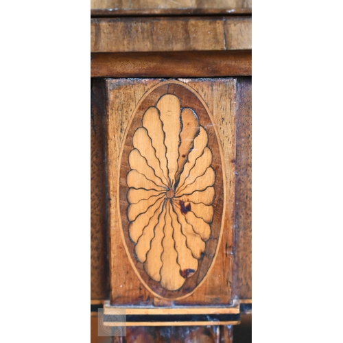 130 - A 19th century mahogany crossbanded demi-lune folding card table on moulded square tapering supports... 