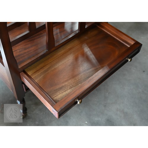 276 - A reproduction four division Canterbury with two drawers and turned supports with small brass caster... 