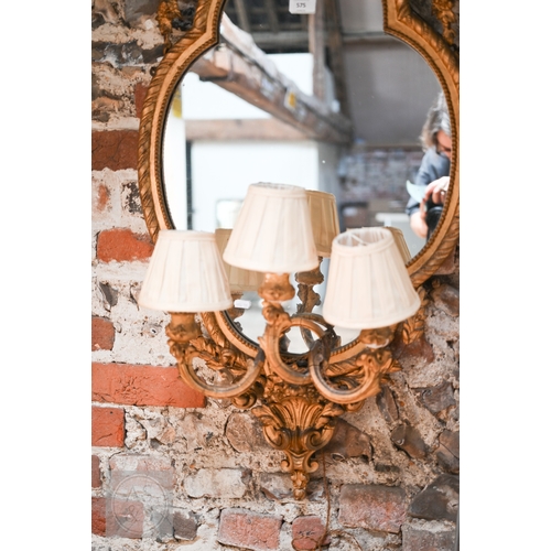 17 - An antique giltwood and gesso girandole mirror in the rococo style, of trefoil form surmounted by a ... 