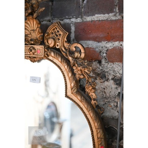 17 - An antique giltwood and gesso girandole mirror in the rococo style, of trefoil form surmounted by a ... 