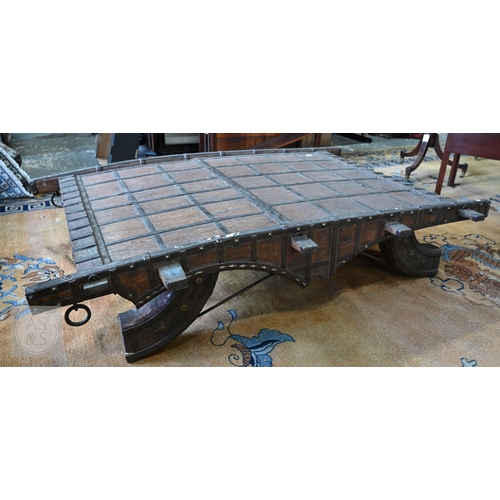 22 - An antique Indian iron bound hardwood ox cart converted to a coffee table, 180 cm x 130 cm x 37 cm h