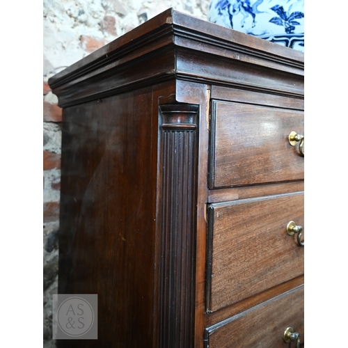 23 - A George III mahogany chest on chest, the moulded cornice over two short and three long graduated dr... 