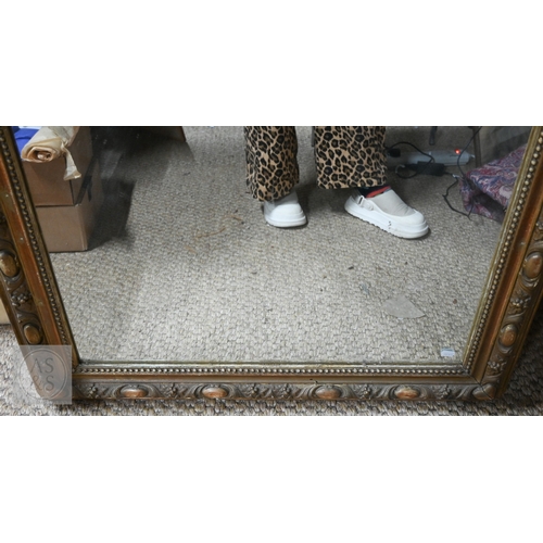 24 - A late 19th century French giltwood framed mirror, surmounted by composite fleur de lys device, 90 c... 