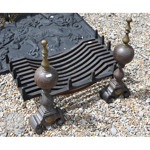 32 - A sand-cast iron fire-back depicting a lion and British National emblems, 66 cm x 79 cm, to/w a pair... 