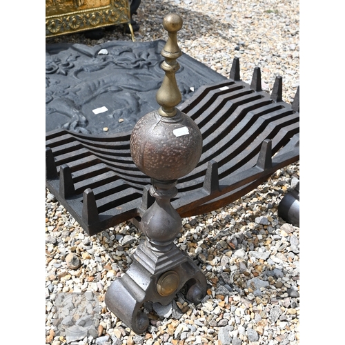 32 - A sand-cast iron fire-back depicting a lion and British National emblems, 66 cm x 79 cm, to/w a pair... 