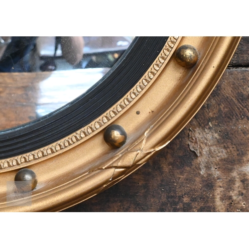 36 - A Regency style gilt convex mirror in ball-mounted gilt frame