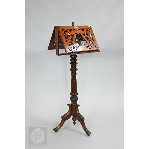 39 - A Regency mahogany double sided tripod music stand, the adjustable easels with fret cut lyre panel r... 