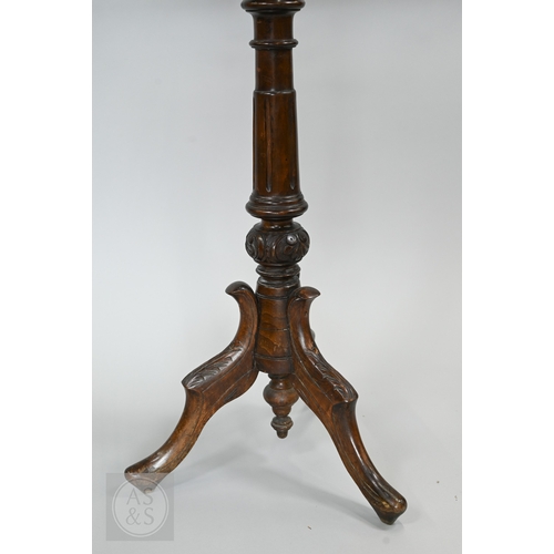 39 - A Regency mahogany double sided tripod music stand, the adjustable easels with fret cut lyre panel r... 