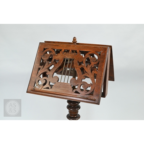 39 - A Regency mahogany double sided tripod music stand, the adjustable easels with fret cut lyre panel r... 