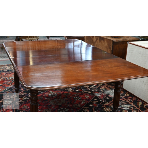 49 - # An early Victorian mahogany draw leaf dining table, the moulded edge top with rounded corners over... 
