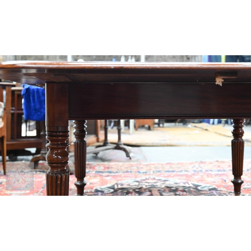 49 - # An early Victorian mahogany draw leaf dining table, the moulded edge top with rounded corners over... 