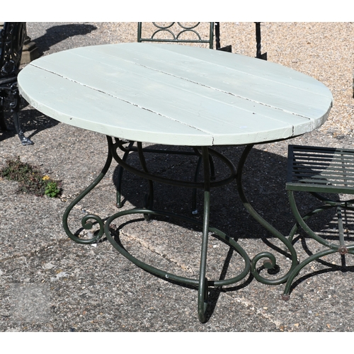 10 - An oval wrought steel oval garden table with rustic wood plank top, to/with a set of four steel chai... 