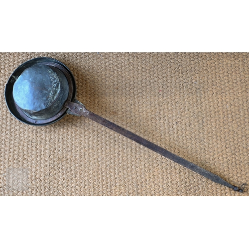 11 - A 17th century iron and brass warming pan, with chased decoration, complete, original, old repair to... 
