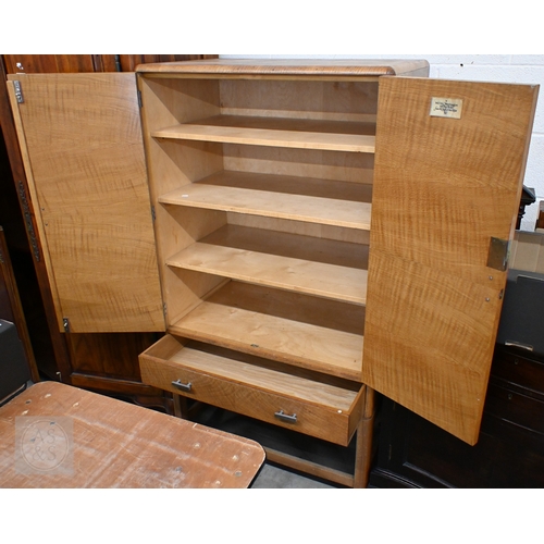 112 - A Heal & Son Art Deco storage cabinet in book-matched oak veneer with chrome-plated handles, the... 