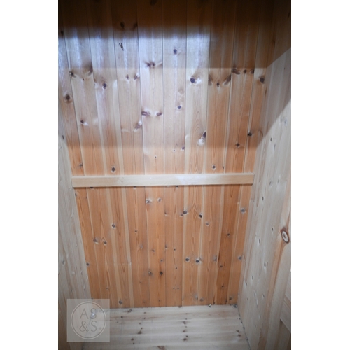 121 - A modern waxed pine child's bedroom suite, comprising small wardrobe with full length panelled doors... 