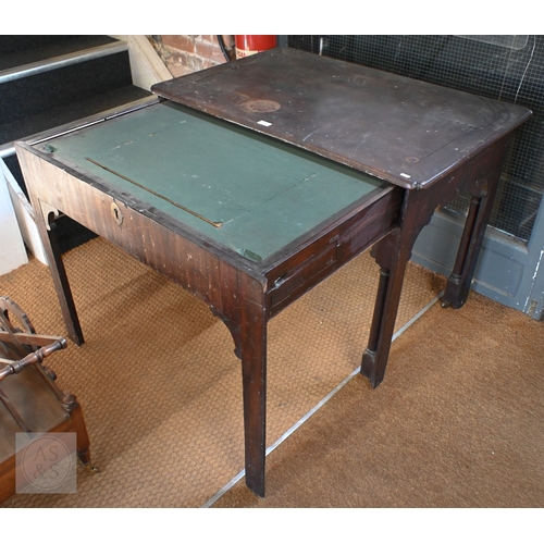 14 - A Georgian mahogany Chippendale period architect's table, on roller castors, heavily distressed over... 