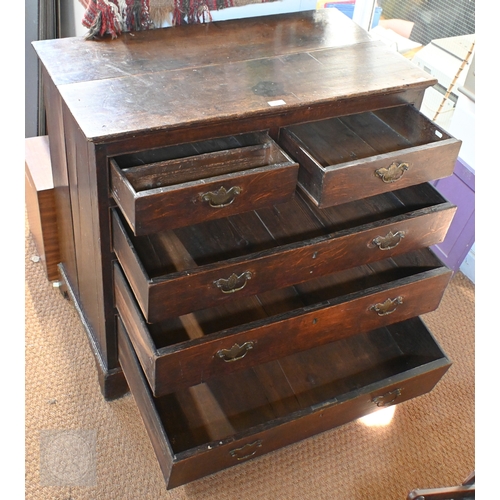 15 - An 18th century boarded oak chest of two short over three long graduated drawers, later brass fittin... 