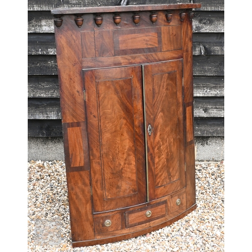 173 - A large George III mahogany wall-hanging barrel-front corner cupboard, 92 x 128 cm high