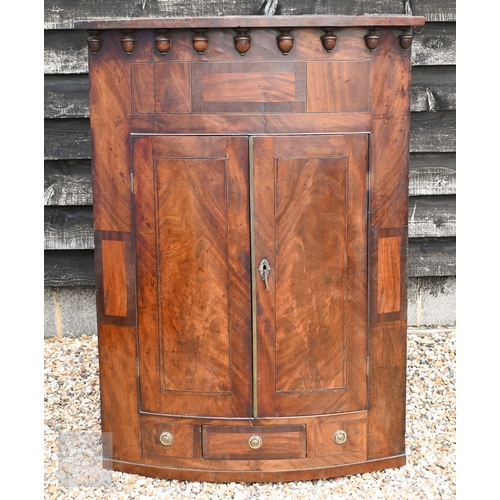 173 - A large George III mahogany wall-hanging barrel-front corner cupboard, 92 x 128 cm high