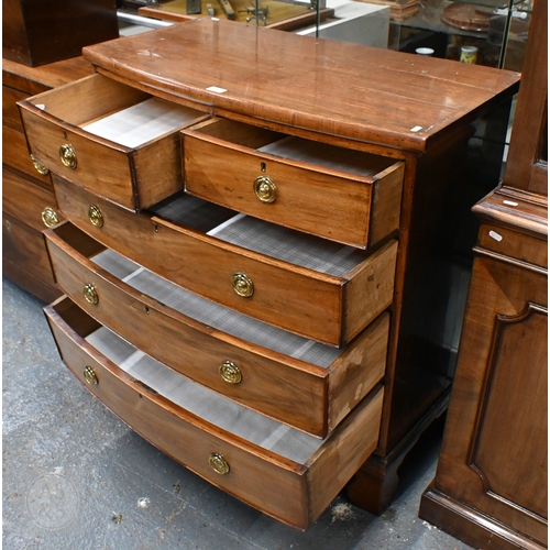 19 - A Victorian mahogany bow-front chest of two short over three longs graduated drawers, with brass fit... 
