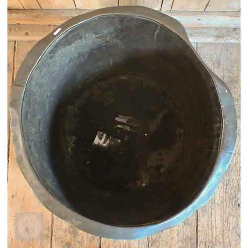 2 - An antique weathered rivetted wash copper log-bin/planter, 57 cm dia. c 40 cm h