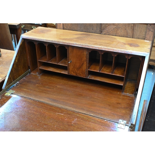 20 - # A compact mahogany bureau, with basic fitted interior over four long graduated drawers, raised on ... 
