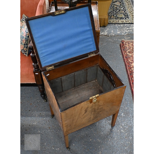 21 - A Victorian mahogany cellarette, the interior with removeable carrier, raised on square supports to ... 