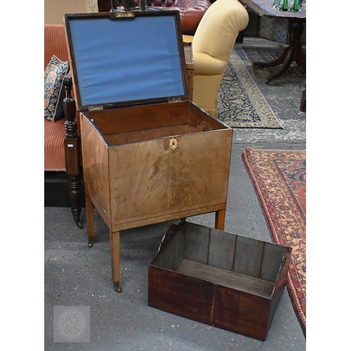 21 - A Victorian mahogany cellarette, the interior with removeable carrier, raised on square supports to ... 