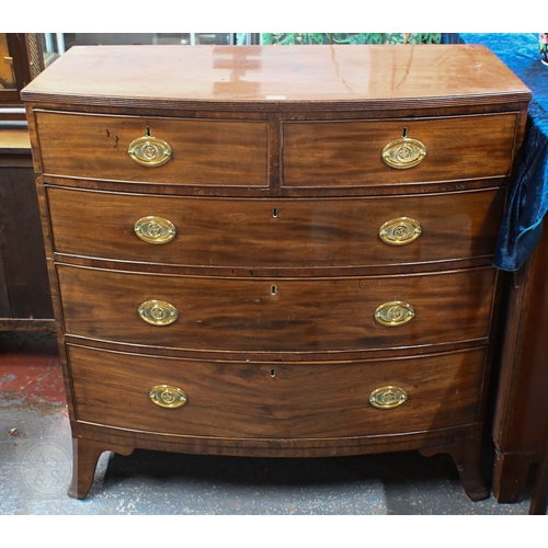27 - A Victorian mahogany bow front chest of two short over three long graduated drawers, raised on splay... 