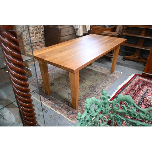 29 - A contemporary extending oak dining table, raised on square legs with detachable ends, by Baltic Fur... 