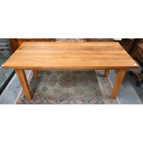 29 - A contemporary extending oak dining table, raised on square legs with detachable ends, by Baltic Fur... 