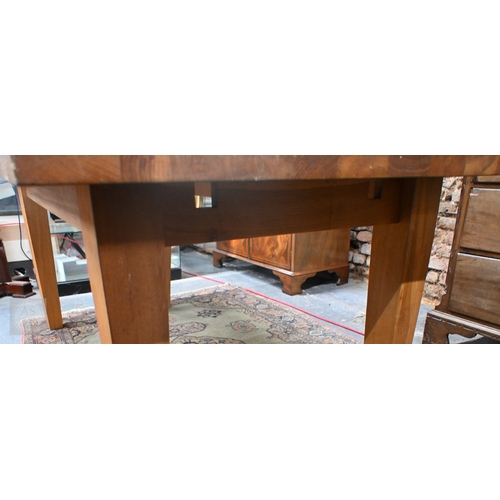 29 - A contemporary extending oak dining table, raised on square legs with detachable ends, by Baltic Fur... 