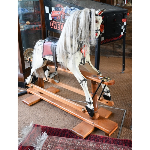 34 - A traditional hand-made wooden rocking horse, circa 1997, with grey and black dappled paint, brass a... 