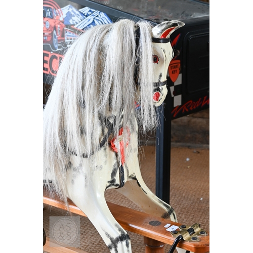 34 - A traditional hand-made wooden rocking horse, circa 1997, with grey and black dappled paint, brass a... 