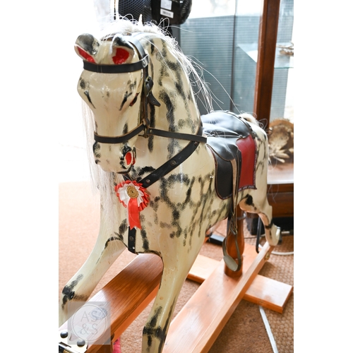 34 - A traditional hand-made wooden rocking horse, circa 1997, with grey and black dappled paint, brass a... 