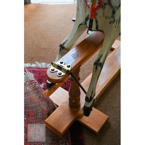 34 - A traditional hand-made wooden rocking horse, circa 1997, with grey and black dappled paint, brass a... 