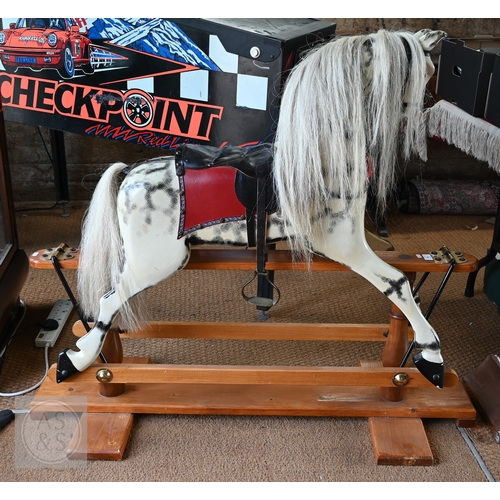 34 - A traditional hand-made wooden rocking horse, circa 1997, with grey and black dappled paint, brass a... 