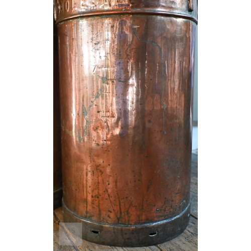 35 - Two antique copper milk churns and covers, one branded for United Dairies, the other for Percy Churc... 